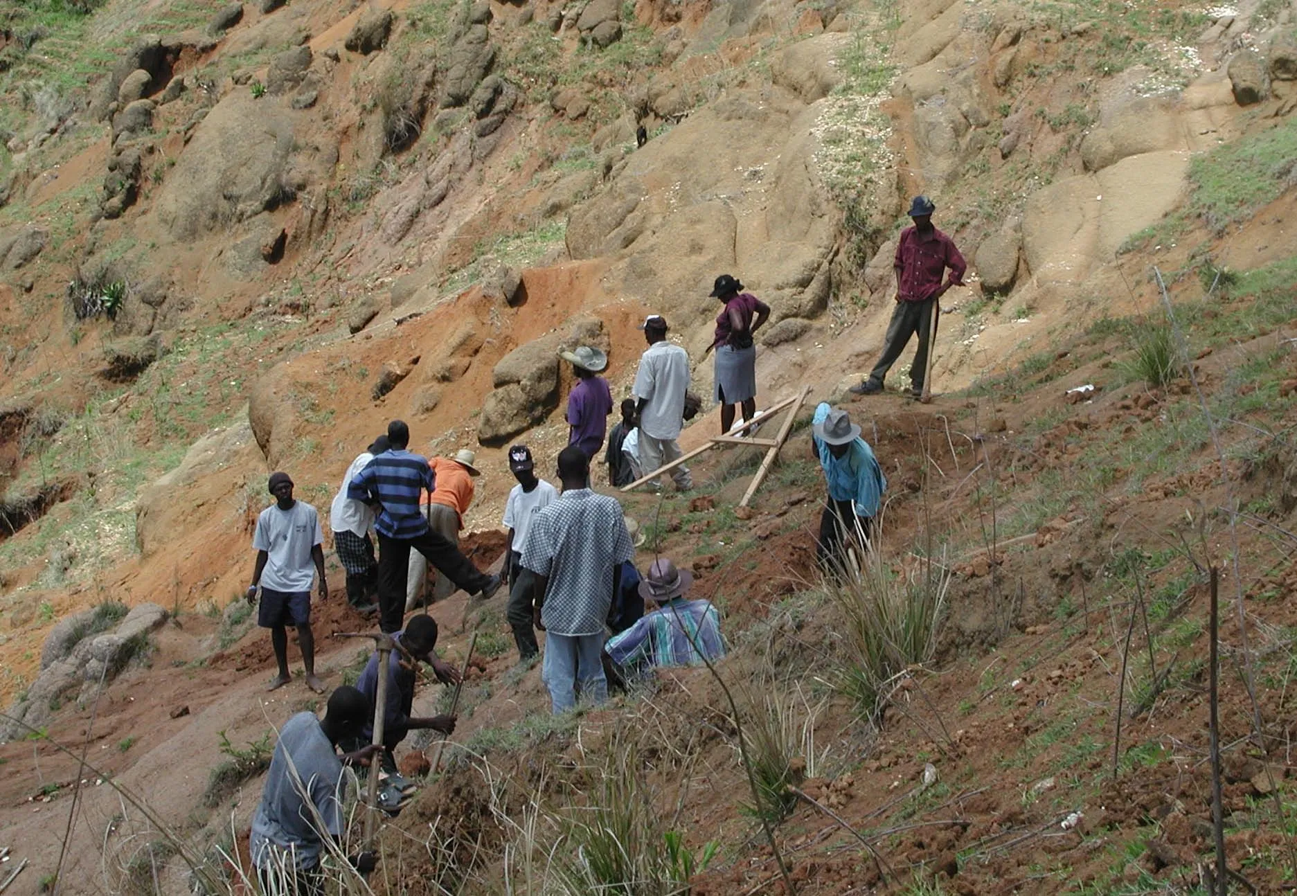The road crew laying gravel by hand, 2006.